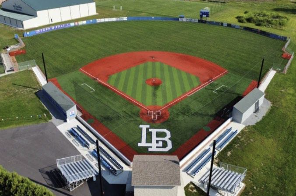 Turf baseball field and backstop